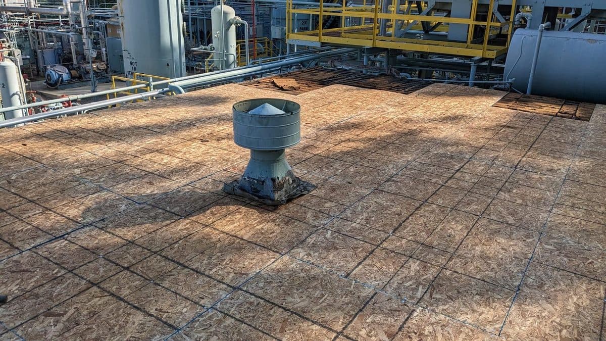 Wood roof deck with a rooftop vent at an industrial site