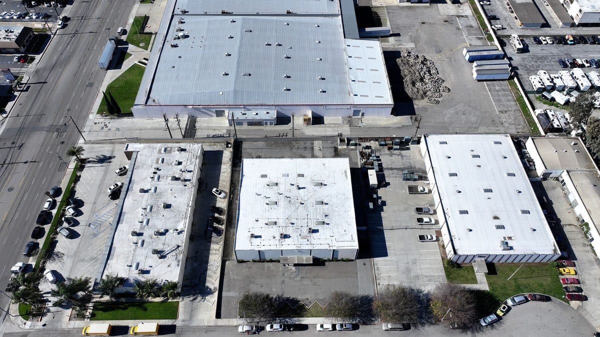 Aerial view of several commercial buildings with flat roofs