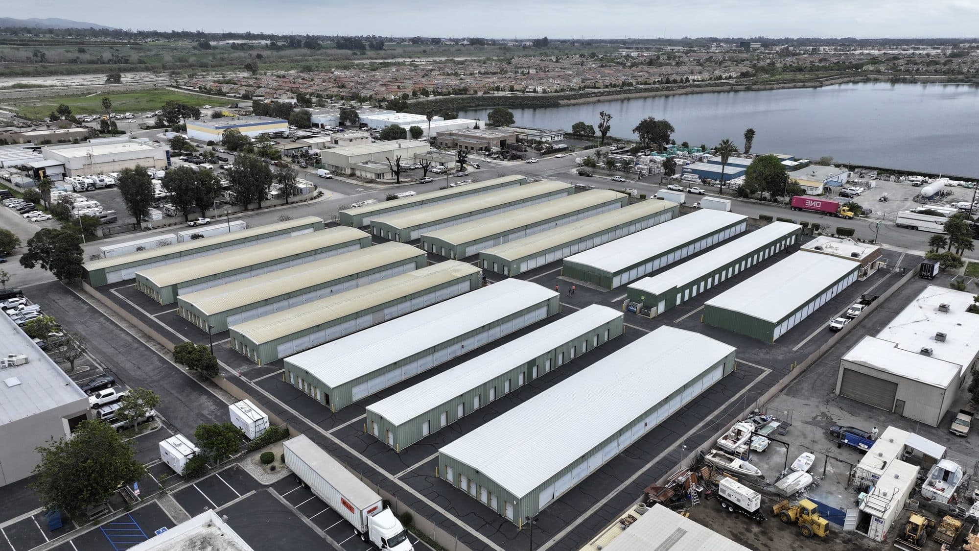 Aerial view of a commercial property with multiple large commercial roofs in Southern California