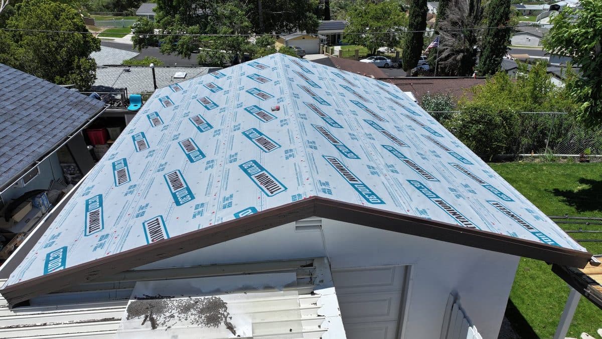 Aerial view of a roof covered in synthetic underlayment