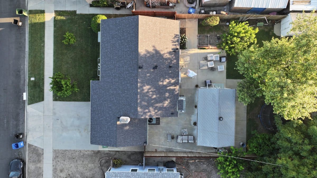 Aerial view of a completed multi-section shingle roof