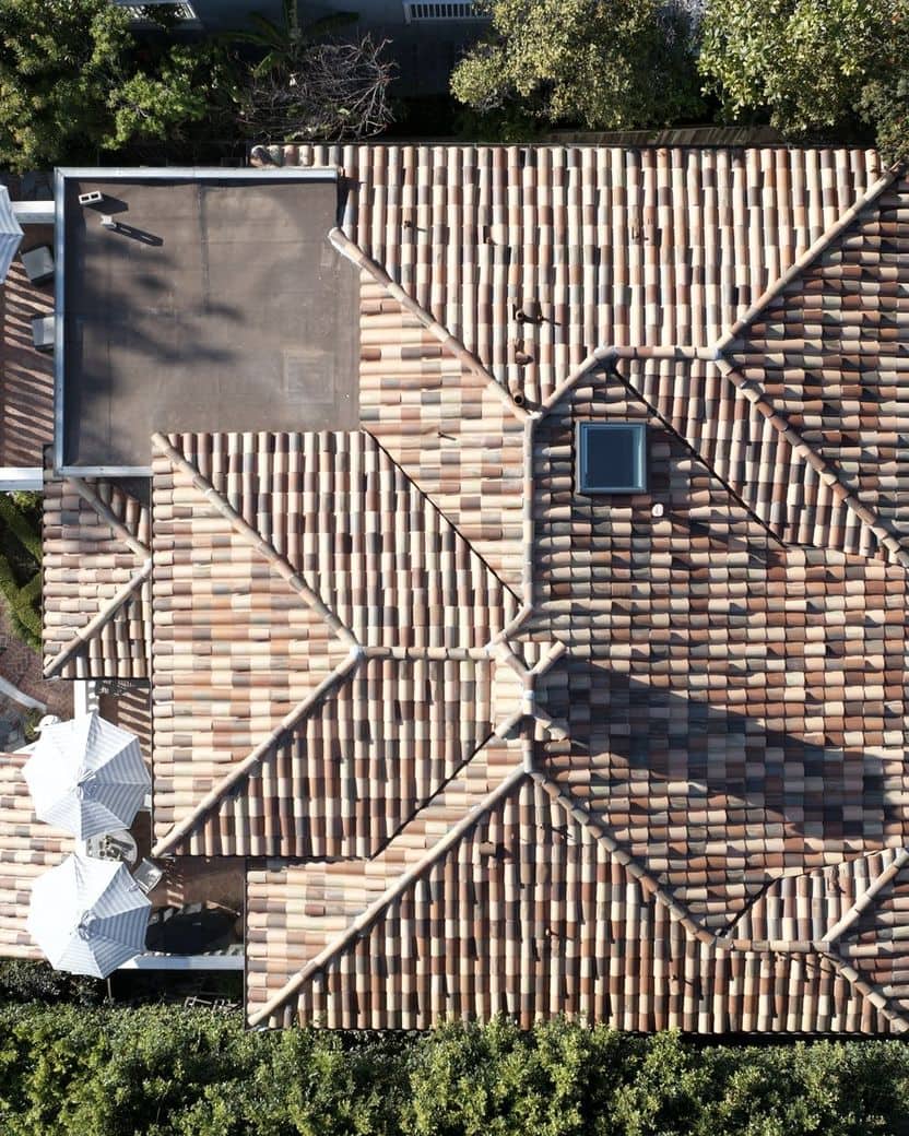 Aerial view of a completed multi-tone clay tile roof